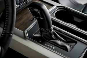 Car interior with automatic transmission, close up gear lever - luxurious details photo