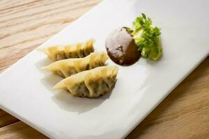 Delicious dumpling served on elegant plate, typical polish food - pierogi gourmet photo