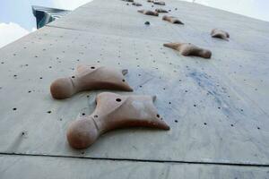 selective focus on artificial rock for rock climbing sports photo