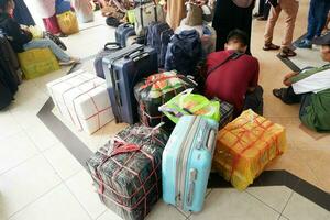 Piles of luggage and belongings of stranded passengers waiting for the ship to depart at Bontang port, East Kalimantan, Indonesia. June 29 2023 photo