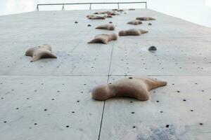 selective focus on artificial rock for rock climbing sports photo