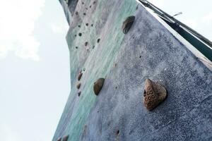 selective focus on artificial rock for rock climbing sports photo