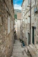 The beautiful steep alleys at the walled old town of Dubrovnik photo