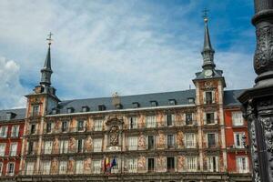 Beautiful antique buildings around Plaza Mayor at Madrid city center photo