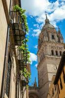 Bell tower of the historical Salamanca Cathedral seen from the Calderon de la Barca street photo