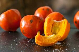 Slice of the exotic tropical fruit of Bactris gasipaes palm tree called chontaduro with salt photo