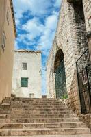 The beautiful steep alleys at the walled old town of Dubrovnik photo