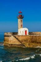 Beautiful early spring day at the historical Felgueiras Lighthouse built on 1886 and located at Douro river mouth in Porto city photo