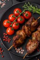 Delicious grilled chicken, turkey or pork skewers with salt, spices and herbs photo