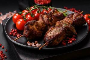 Delicious grilled chicken, turkey or pork skewers with salt, spices and herbs photo