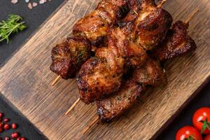 Delicious grilled chicken, turkey or pork skewers with salt, spices and herbs photo