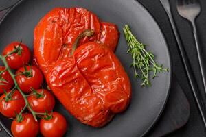 Delicious juicy grilled peppers with spices and herbs photo