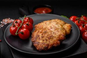 Delicious fresh fried minced chicken meat cutlets with salt, spices and herbs photo