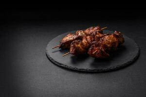 Delicious grilled chicken, turkey or pork skewers with salt, spices and herbs photo