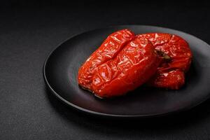 Delicious juicy grilled peppers with spices and herbs photo