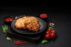 Delicious fresh fried minced chicken meat cutlets with salt, spices and herbs photo