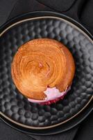 Round puff pastry croissant with raspberry filling or new york roll photo