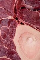 Fresh raw beef steak with bone or ossobuco with salt, spices and herbs photo