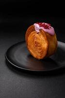 Round puff pastry croissant with raspberry filling or new york roll photo