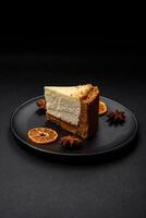 Delicious sweet cheesecake cake on textured concrete background photo