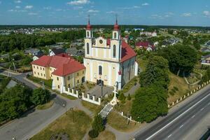 aerial view on neo gothic or baroque temple or catholic church in countryside photo