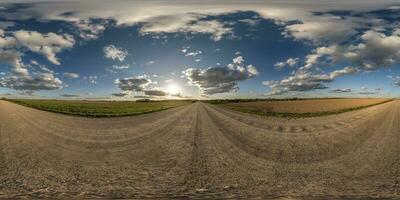 panorama 360 hdri on gravel road with evening clouds on blue sky before sunset in equirectangular spherical seamless projection, use as sky replacement in drone panoramas, game development as sky dome photo