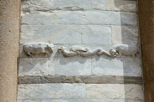 Detail of the stone carvings on the walls of the Leaning Tower of Pisa photo