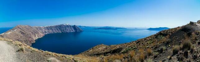 Panorama of the Santorini island and the Cyclades seen from the walking trail number 9 between the cities of Fira and Oia in the Santorini Island photo