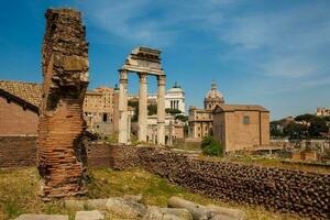 Remains of the Temple of Castor and Pollux or the Dioscuri at the Roman Forum in Rome photo