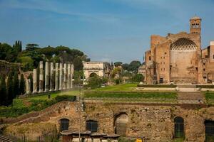 Ruins of the Temple of Venus and Roma located on the Velian Hill and Arch of Titus photo