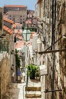 The beautiful steep alleys at the walled old town of Dubrovnik photo