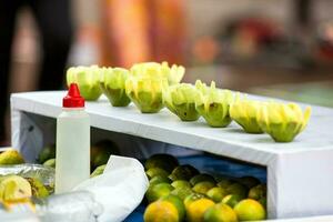 Street vendor of green mango in the city of Cali in Colombia photo