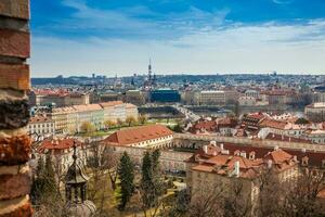 The beautiful Prague city old town seen form the Prague Castle viewpoint in an early spring day photo