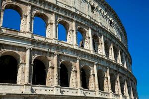 Detail of the famous Colosseum or Coliseum also known as the Flavian Amphitheatre in the centre of the city of Rome photo