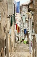 The beautiful steep alleys at the walled old town of Dubrovnik photo