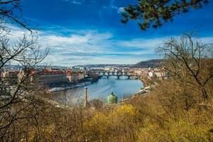 Prague city seen from the Letna hill in a beautiful early spring day photo