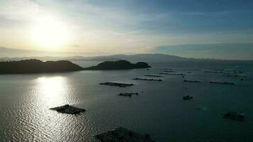 Aerial rotating view kelong fish farm in sunset hour at Pulau Aman, Penang video