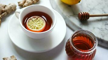 lemon tea with honey and ginger on table video