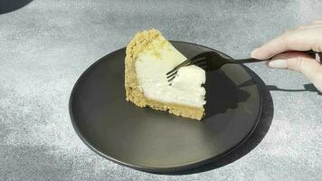 Delicious sweet cheesecake cake on textured concrete background. Delicious breakfast dessert video