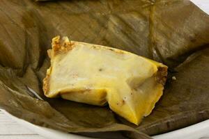 Traditional dish from the city of Popayan in Colombia called tamales de pipian photo