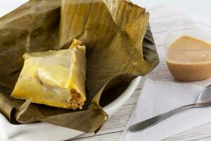 Traditional dish from the city of Popayan in Colombia called tamales de pipian photo