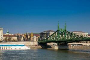 Liberty Bridge or Freedom Bridge over the Danube river in Budapest photo