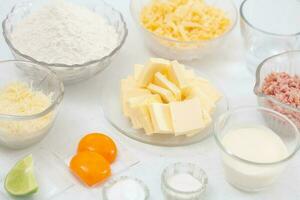 Ingredients to prepare a a delicious cheese and ham tartlet photo