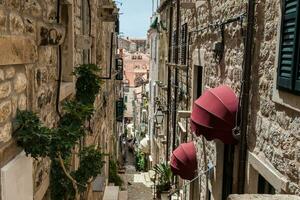 The beautiful steep alleys at the walled old town of Dubrovnik photo