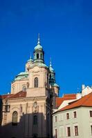 Church of Saint Nicholas located at the old town in Prague photo