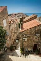 The beautiful steep alleys at the walled old town of Dubrovnik photo