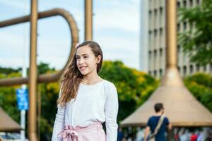 Beautiful young girl at the Jairo Varela Square in the city of Cali in Colombia photo