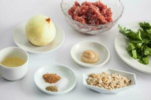 Step by step Levantine cuisine kibbeh preparation. Ingredients to prepare kibbeh filling mix photo