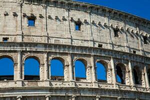 Detail of the famous Colosseum or Coliseum also known as the Flavian Amphitheatre in the centre of the city of Rome photo