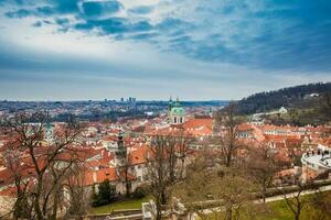 The beautiful Prague city old town seen form the Prague Castle viewpoint in an early spring day photo